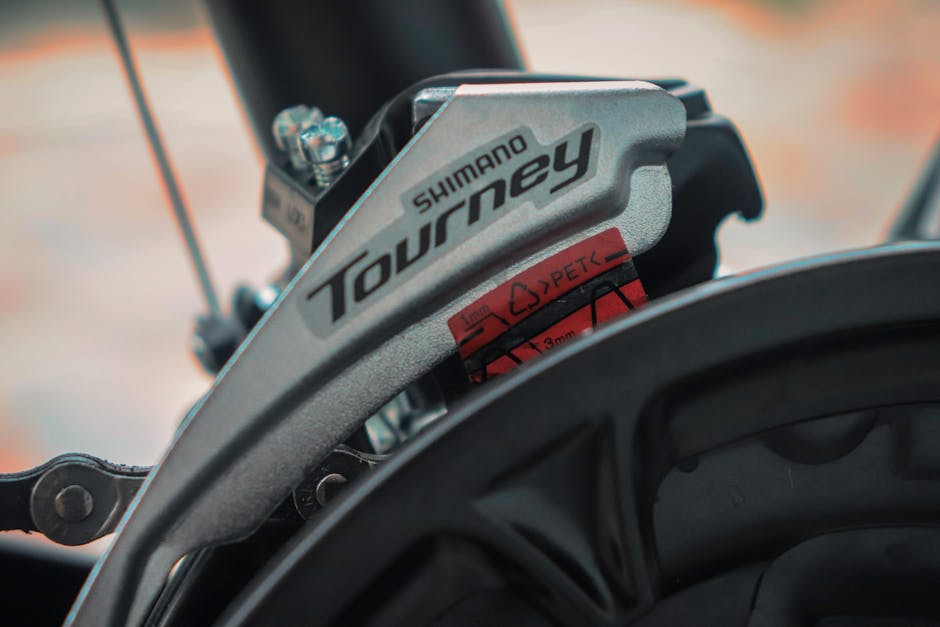 Detailed view of Shimano Tourney gear on a bicycle, highlighting mechanical precision and design.